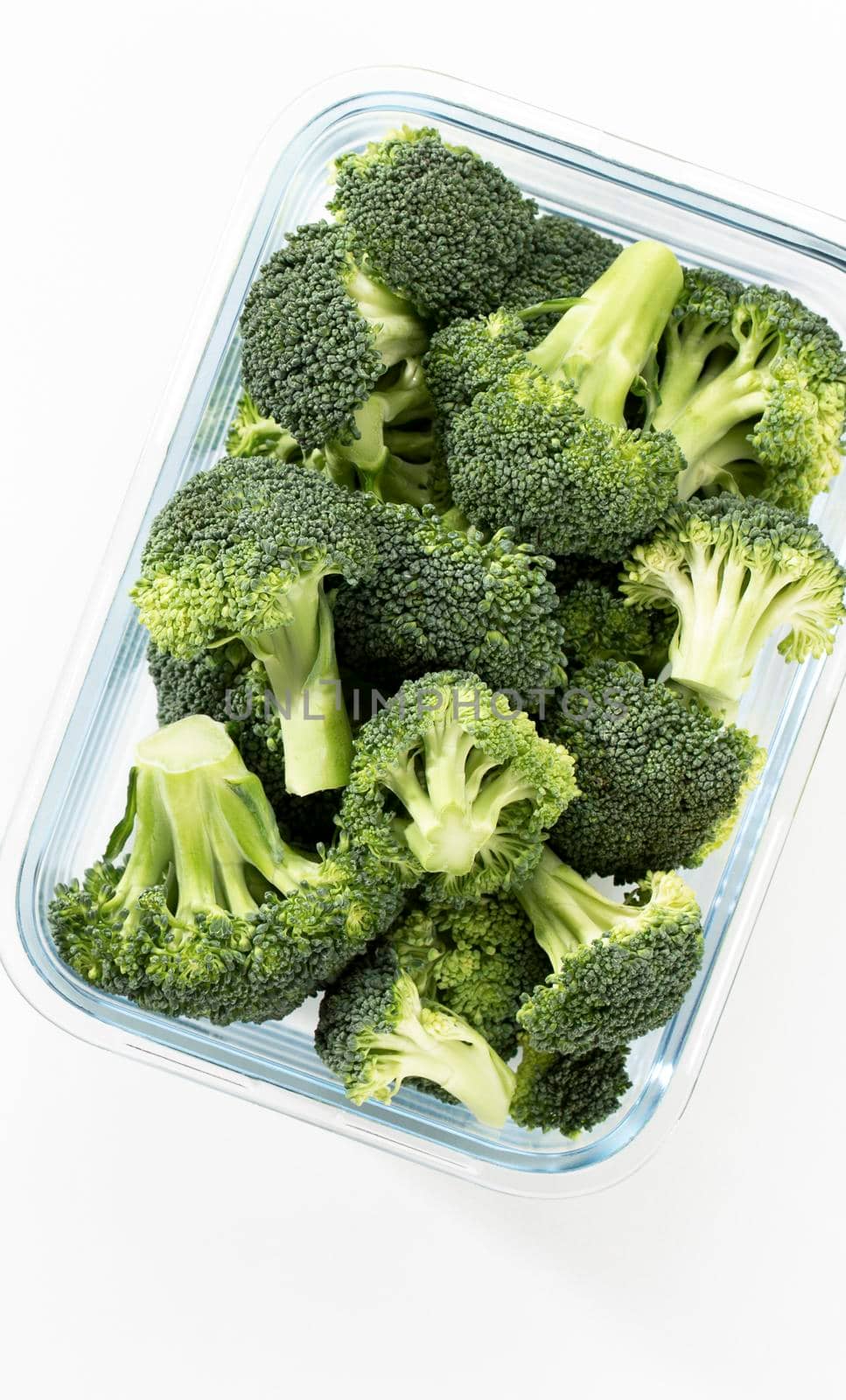Washed And Sliced Broccoli Crown In Glass Container.V by gitusik