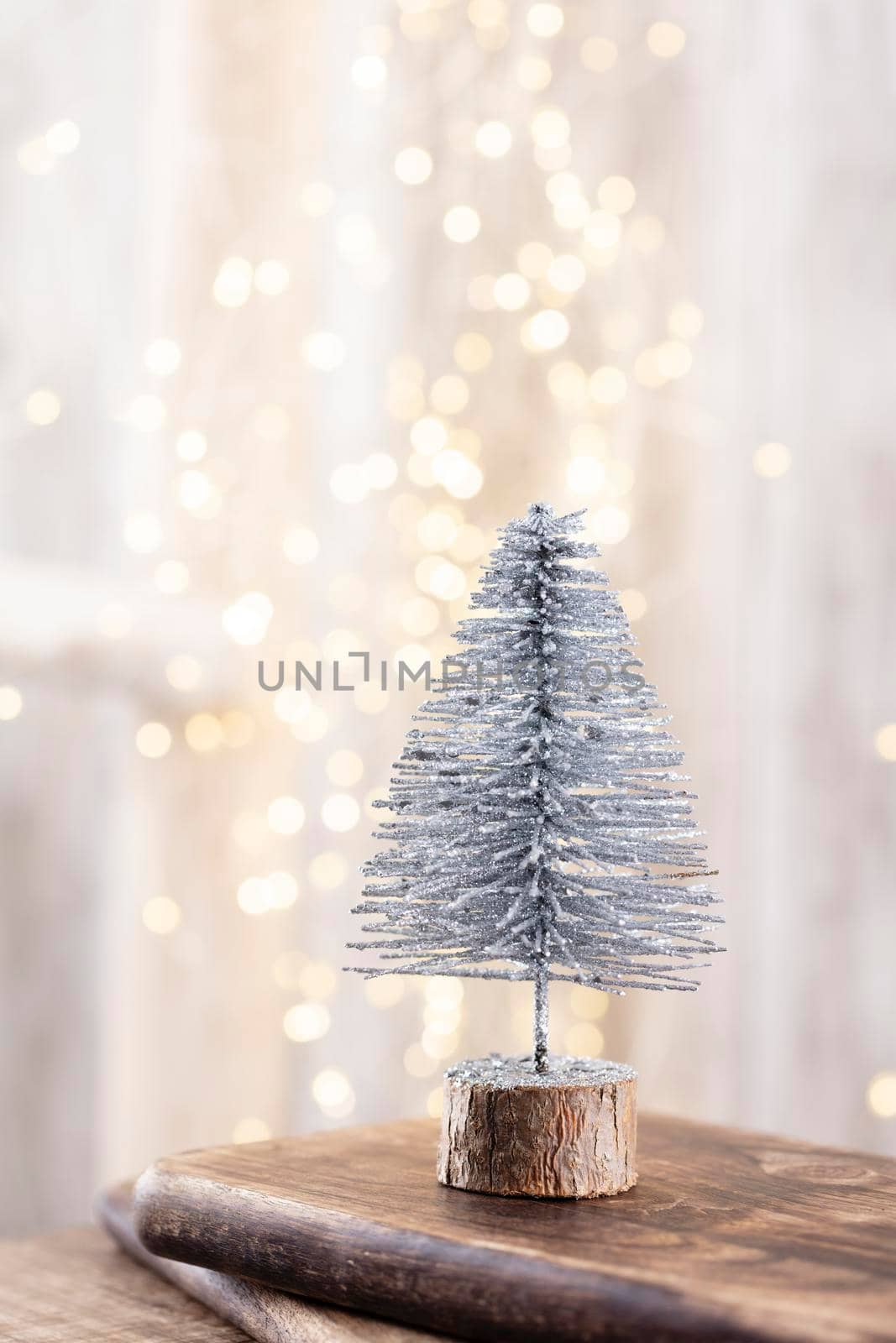 Christmas tree on wooden, bokeh background. Christmas holiday celebration concept. Greeting card.