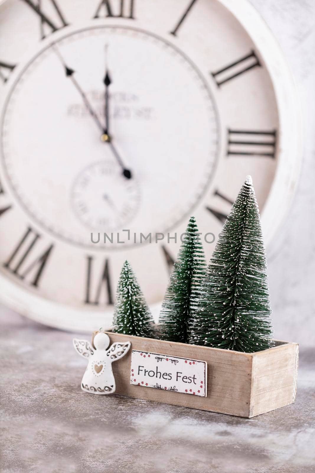 Christmas clock with winter decoration. Happy new year concept by gitusik