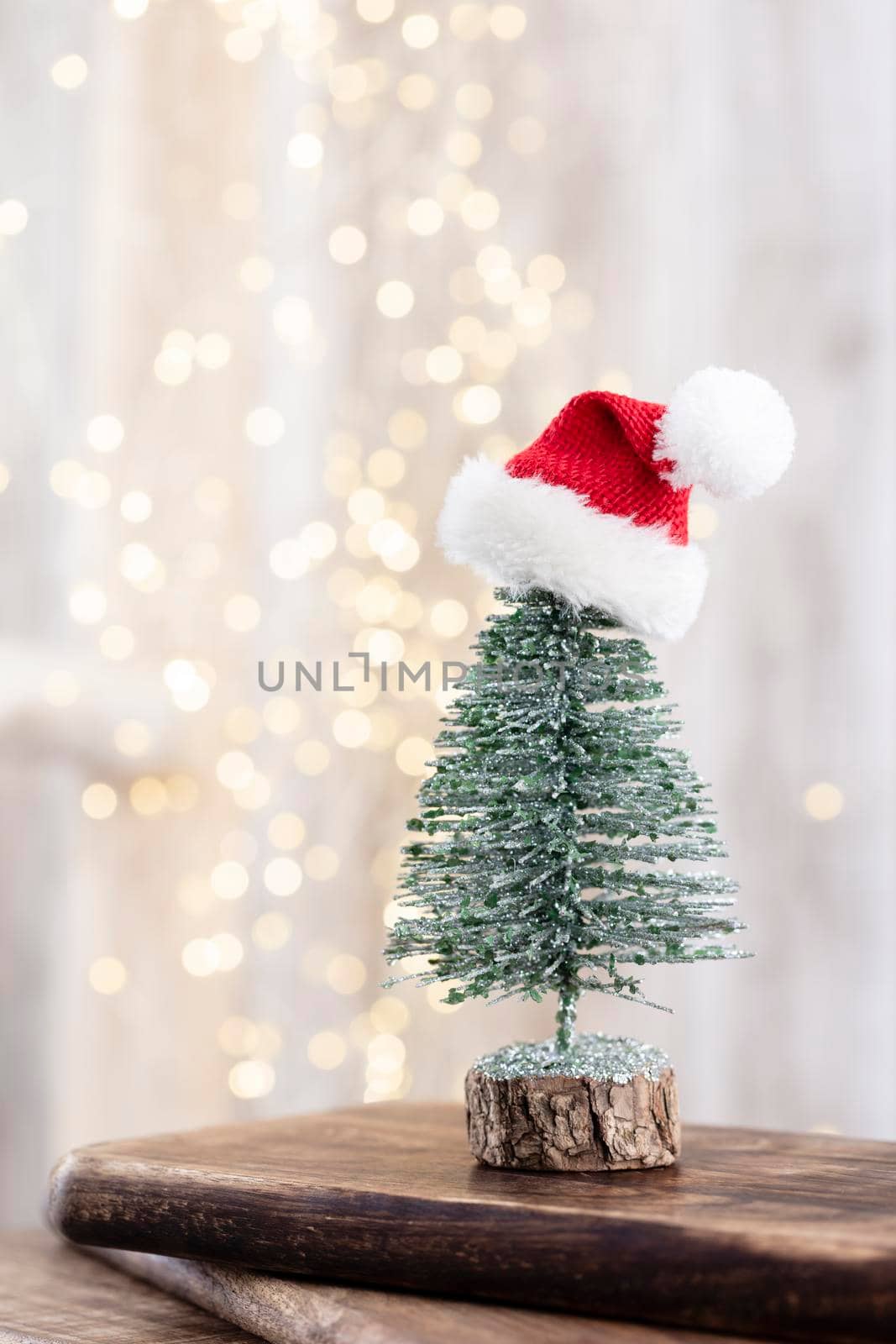 Christmas tree on bohek wooden, bokeh background.  by gitusik