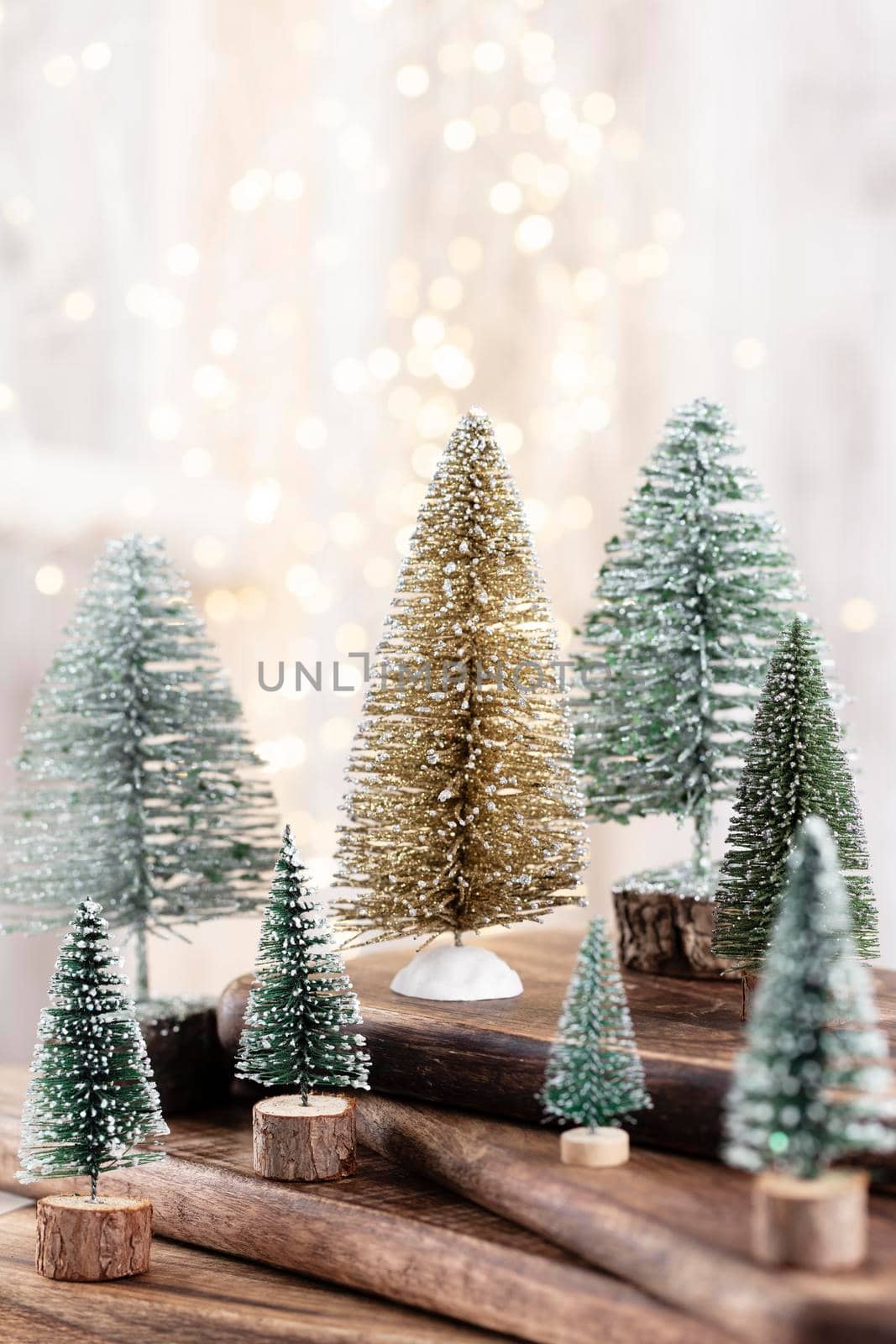 Christmas tree on wooden, bokeh background. Christmas holiday celebration concept. Greeting card.
