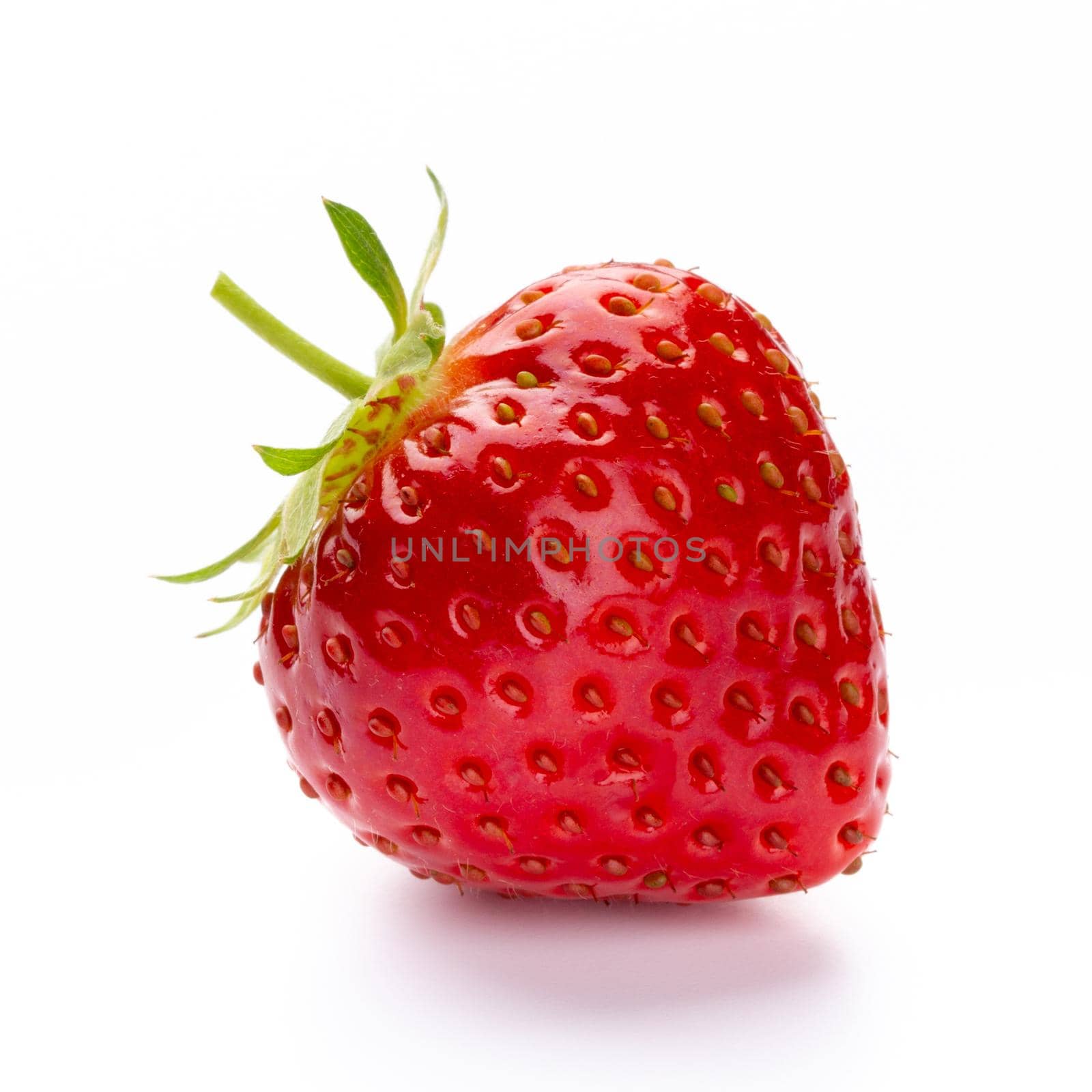 Fresh strawberries closeup on a white background. Isolated - Image by gitusik