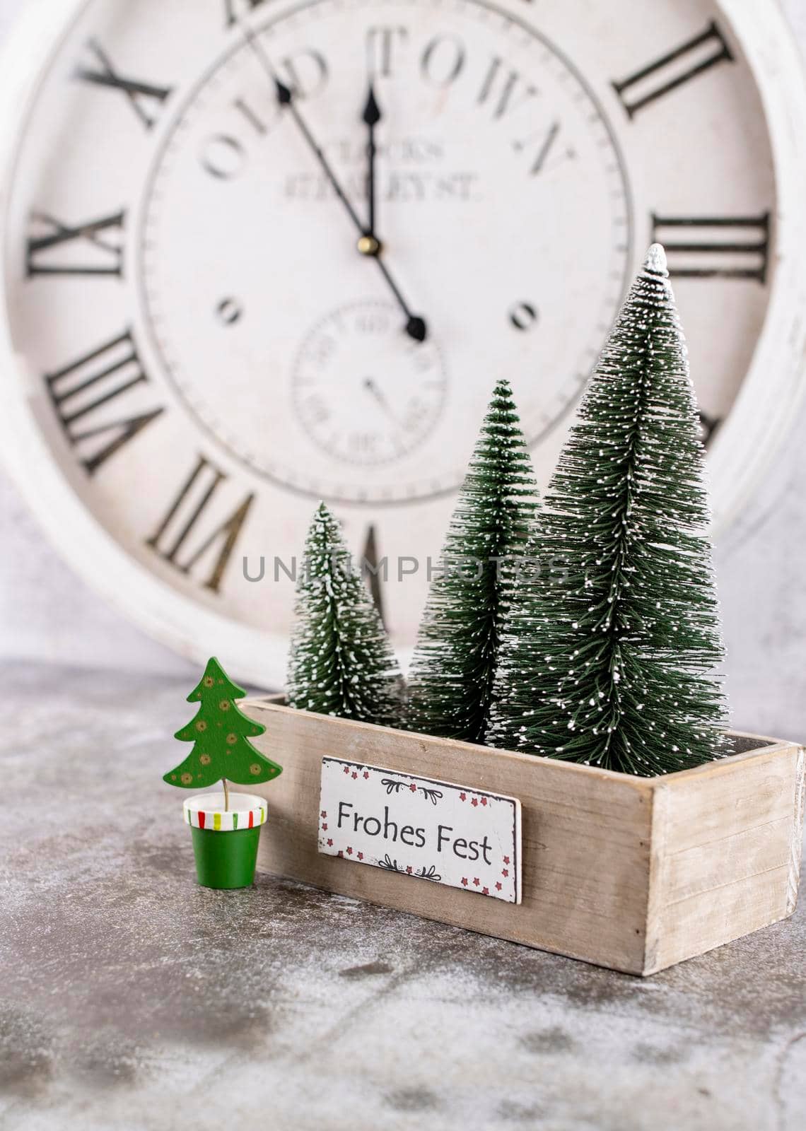 New Year's clock. Decorated with christmas tree decorations background. Celebration Concept for New Year Eve.