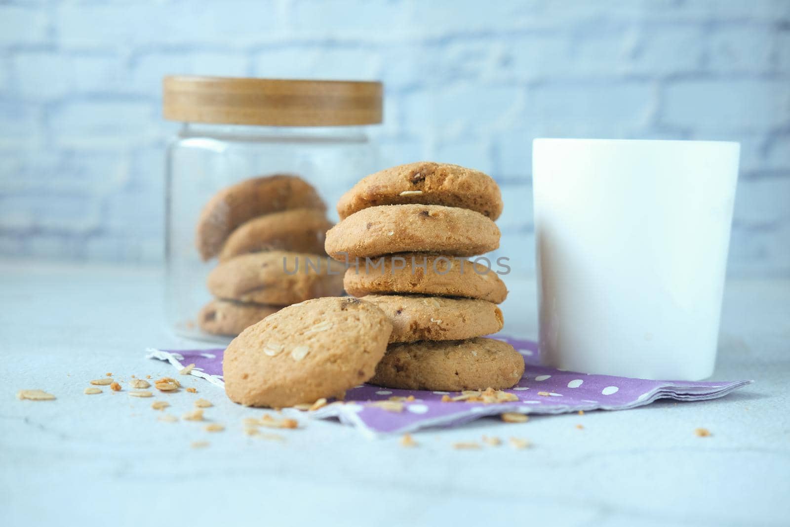 stack of chocolate cookies on wooden background.