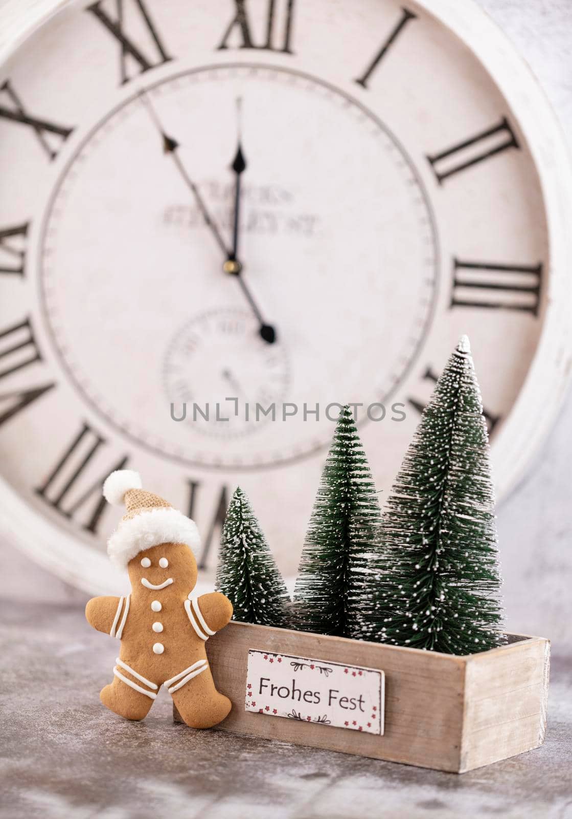 Christmas clock with winter decoration. Happy new year concept by gitusik