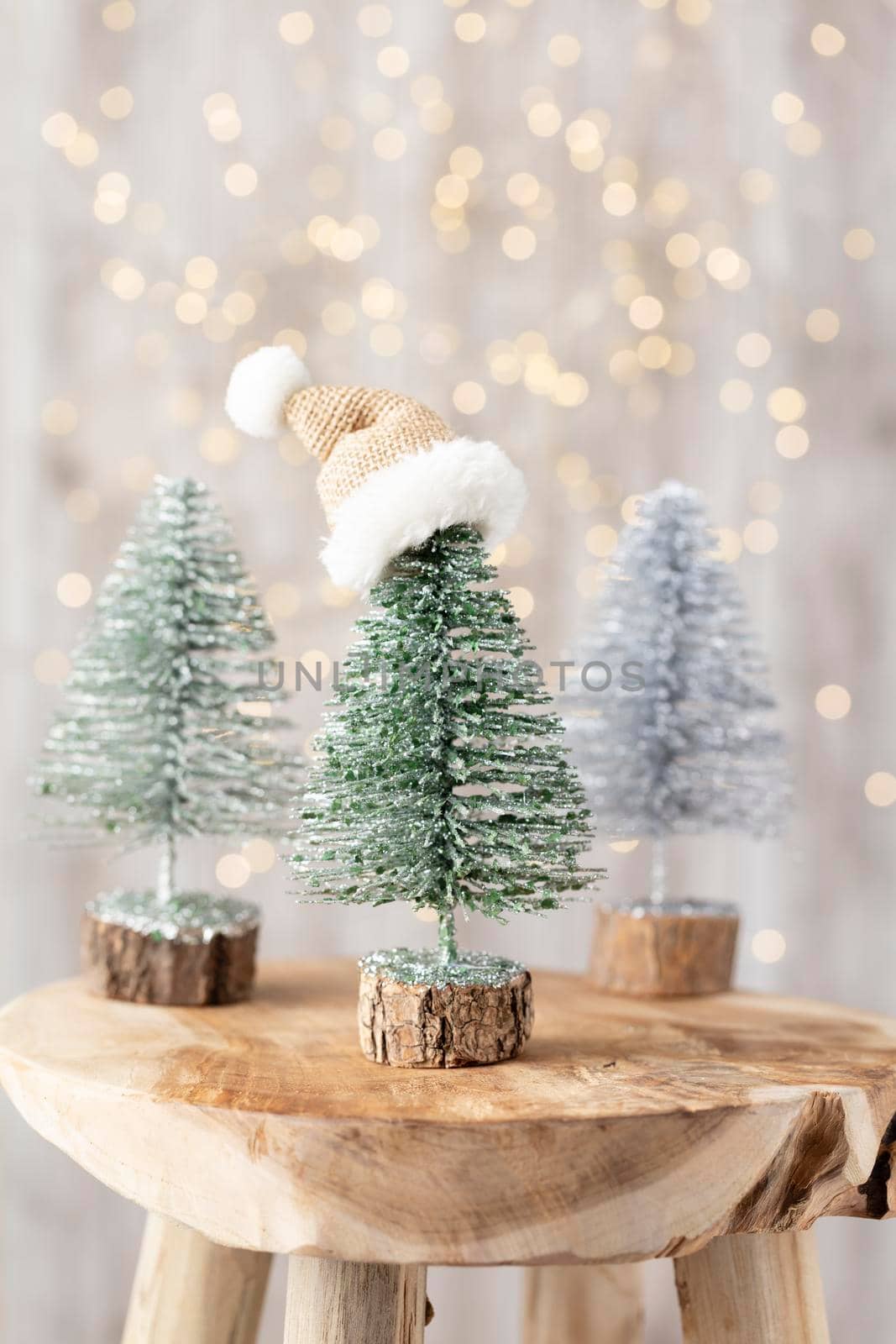 Christmas tree on bohek wooden, bokeh background.  by gitusik