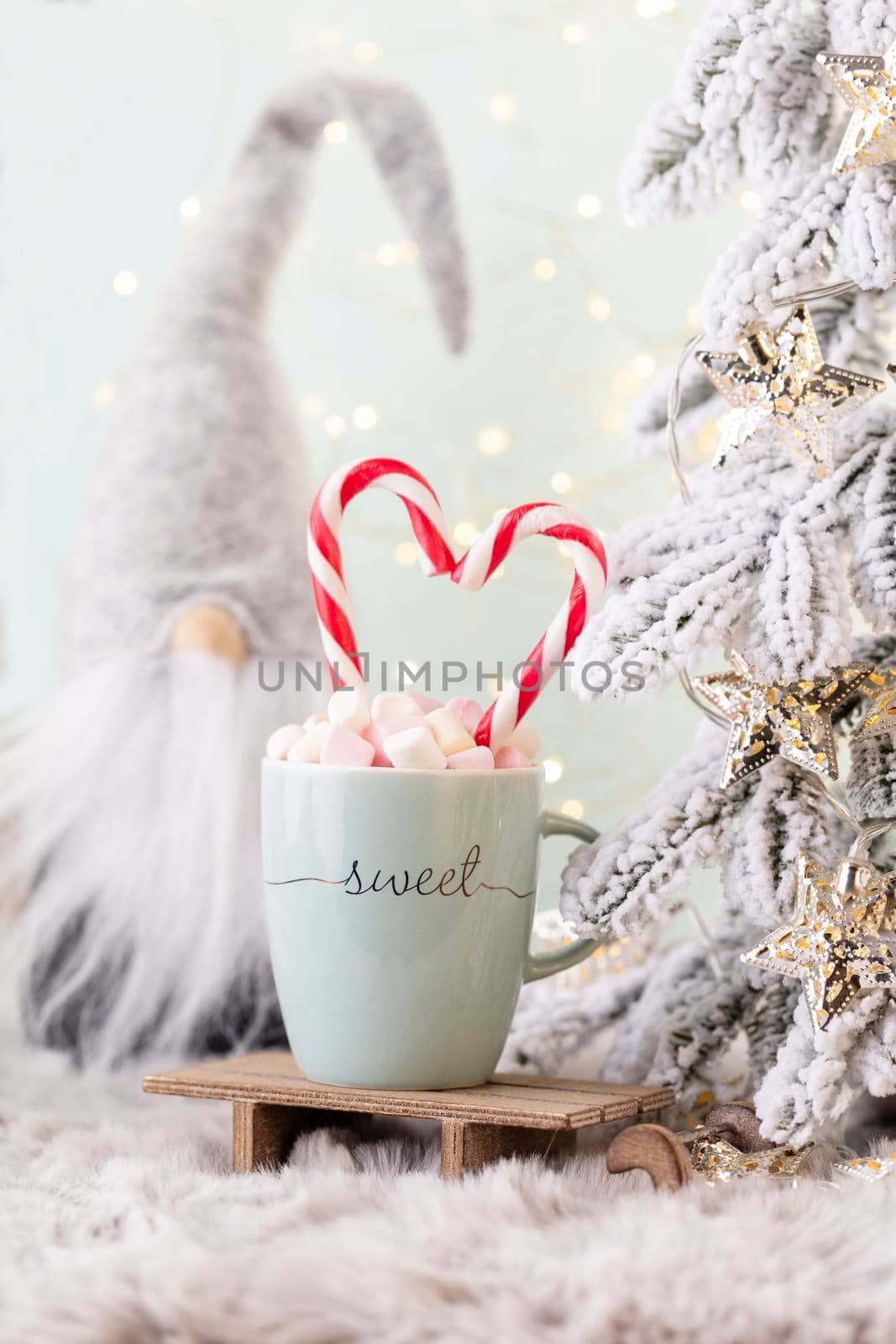 Christmas candy cane heart, bokeh background. by gitusik