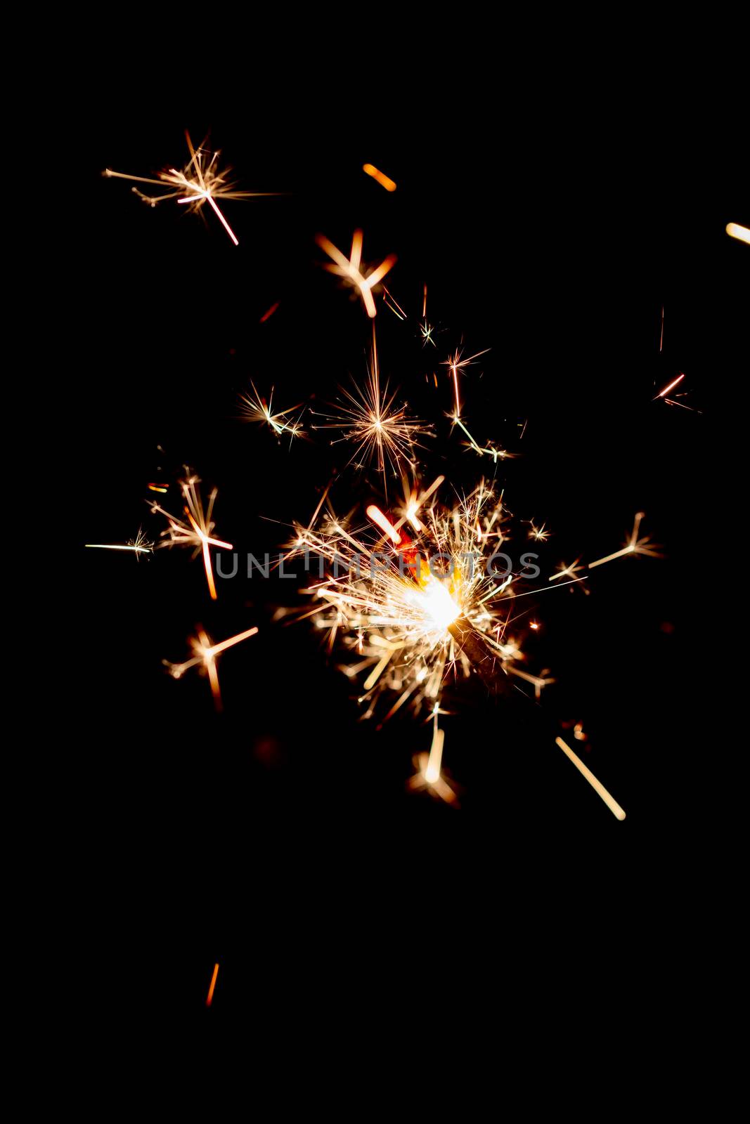One bengal fire sparkles against the black background. by gitusik