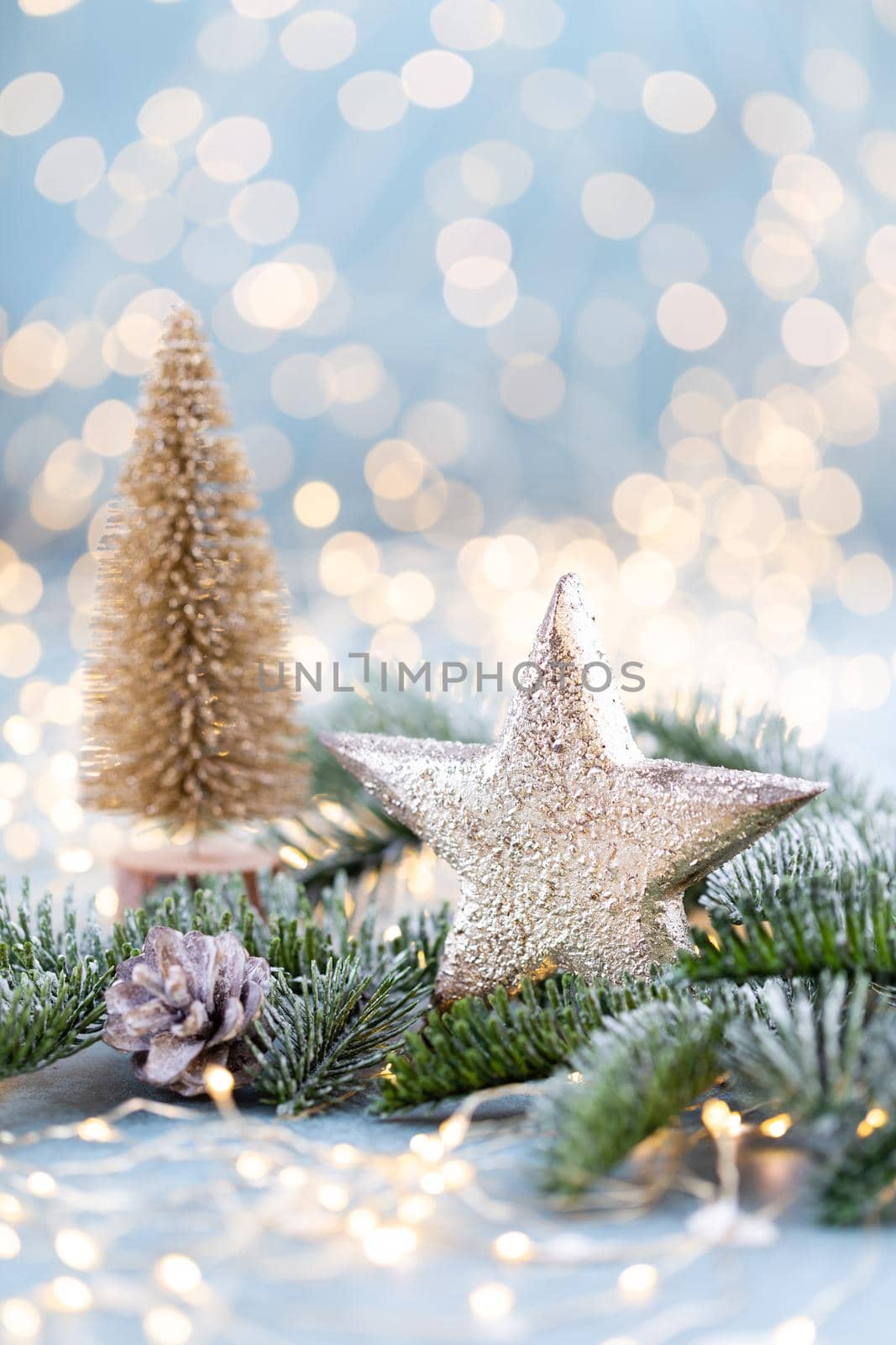 Christmas spruce with star and blurred shiny lights. by gitusik