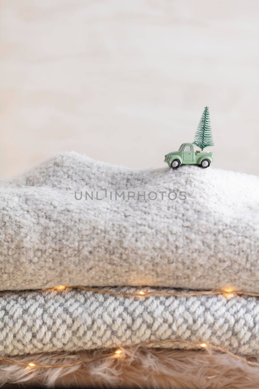 Toy car with a christmas tree, bokeh background by gitusik