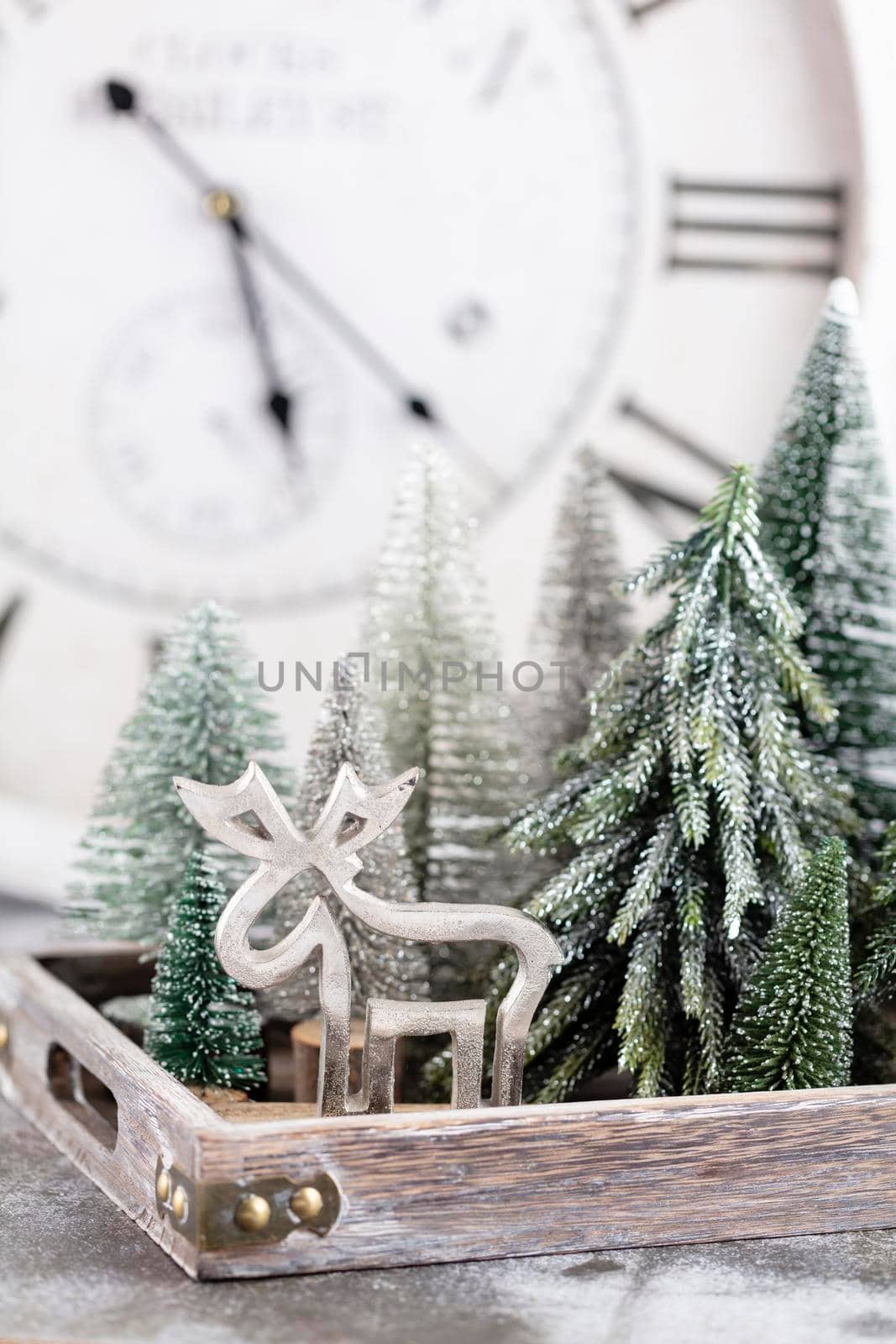 Christmas clock with winter decoration. Happy new year concept by gitusik