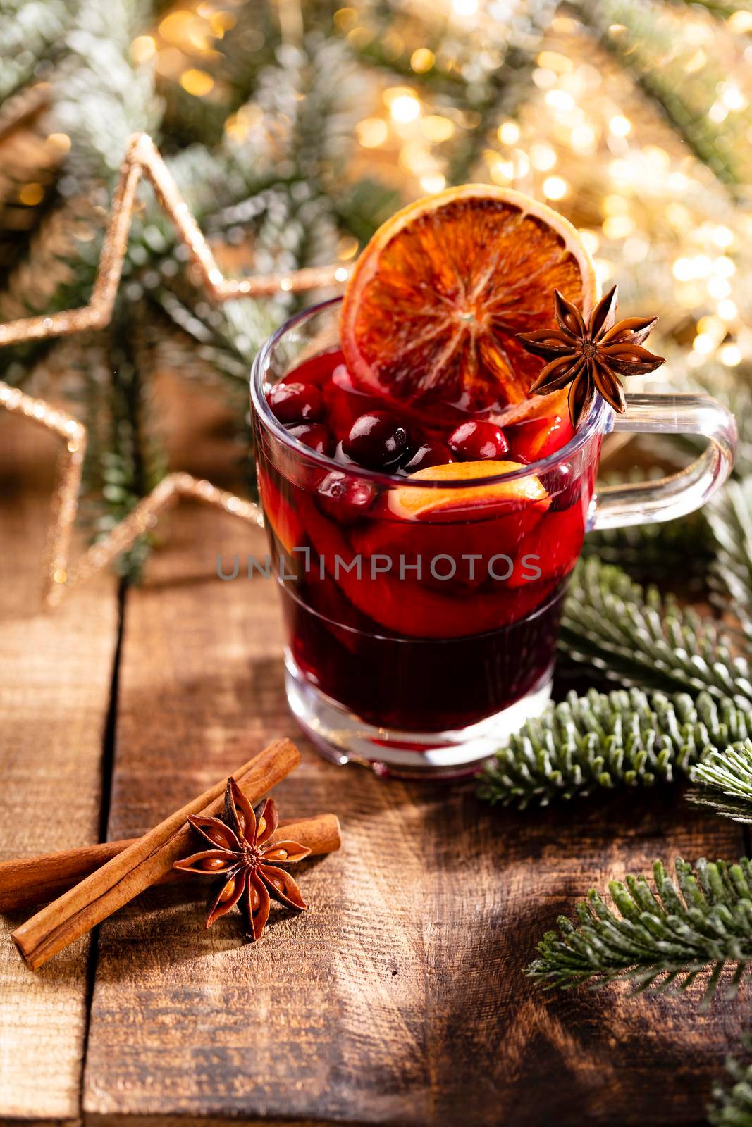 Christmas mulled wine with spices on a wooden rustic table. by gitusik