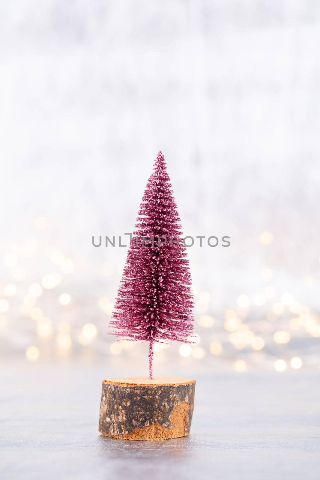 Christmas tree on silver, bokeh background.