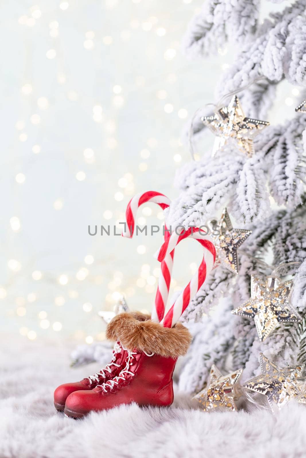 Christmas candy cane heart, bokeh background. by gitusik