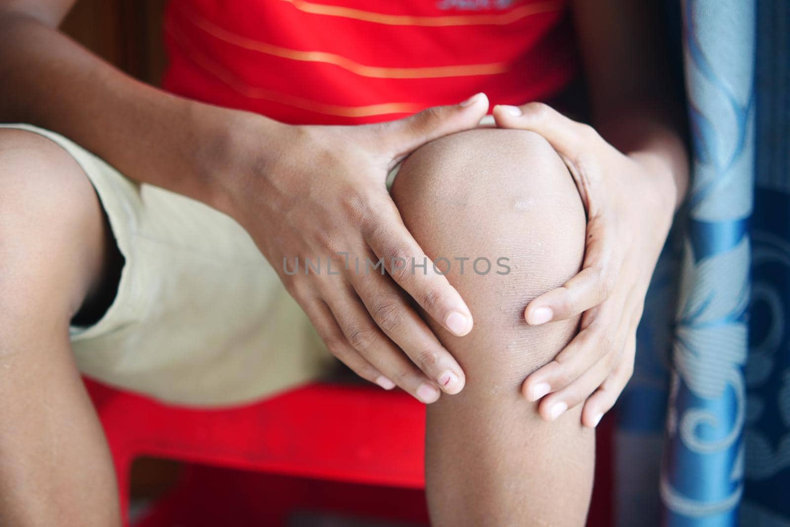 Close up on man suffering knee joint pain.