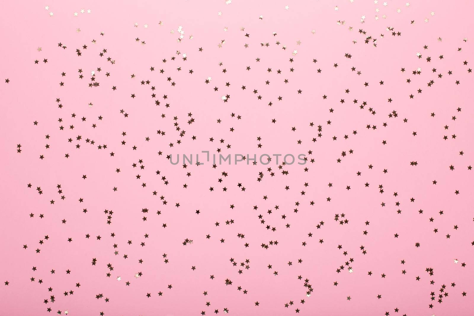 Glittering christmas background. Star dust and golden glitter. Holidays background for web and print.
