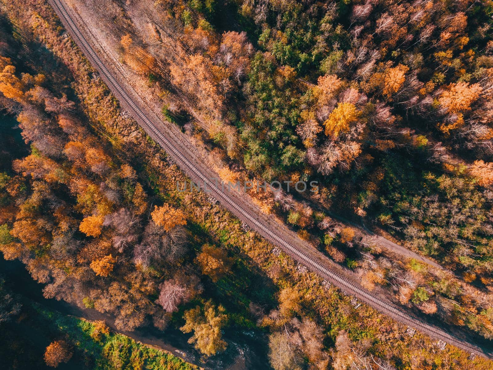 Aerial view of autumn countryside with railway by artush