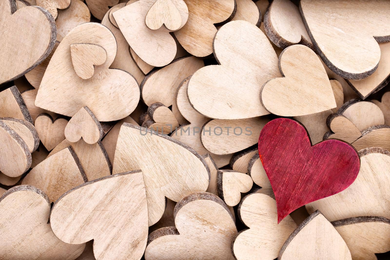 Wooden hearts pattern, one red heart on the wooden heart background.	
