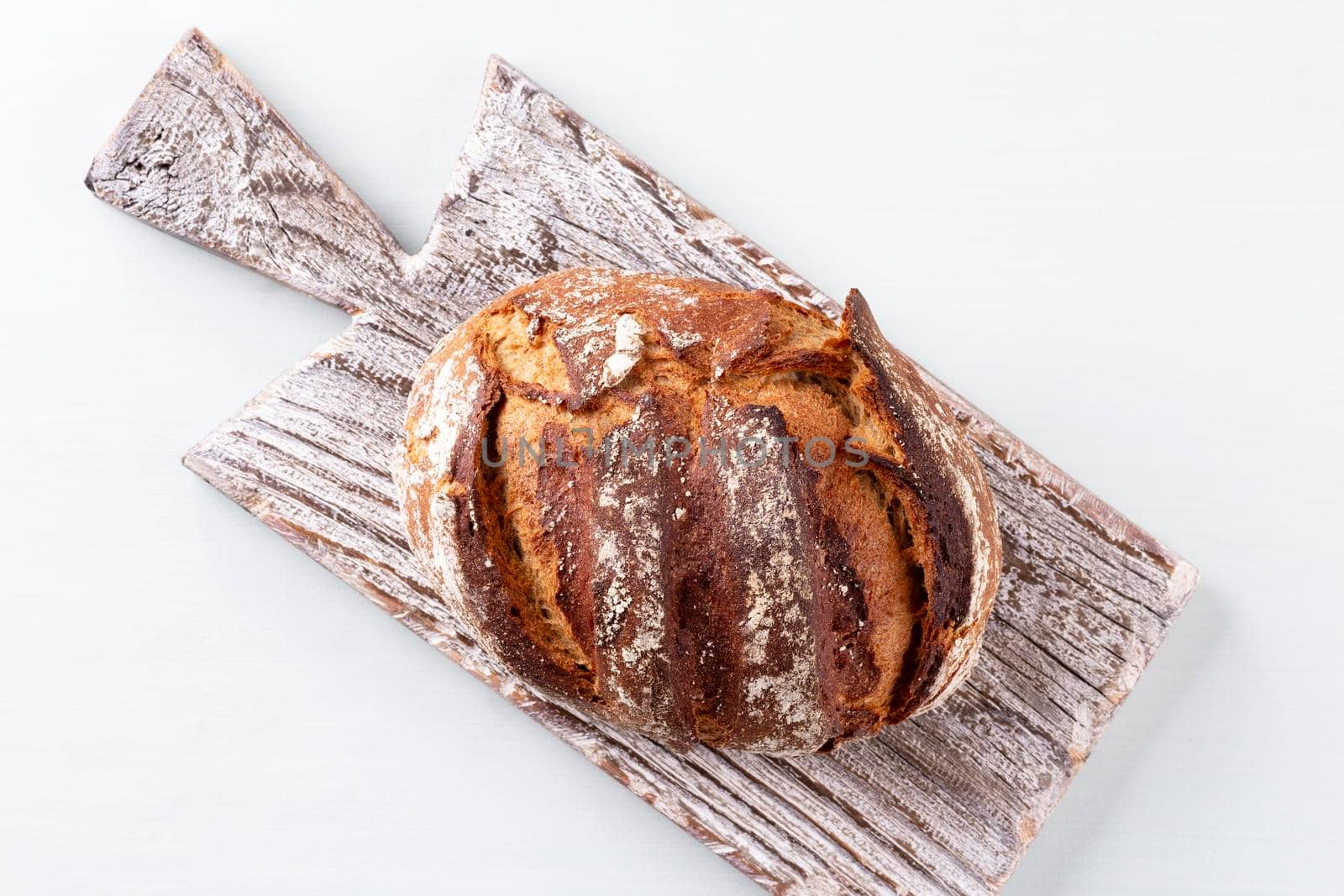 Sliced rye bread on cutting board, closeup.. by gitusik