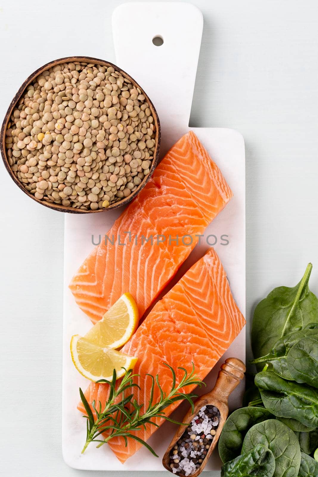 Fresh salmon steak with spinach and lentils.