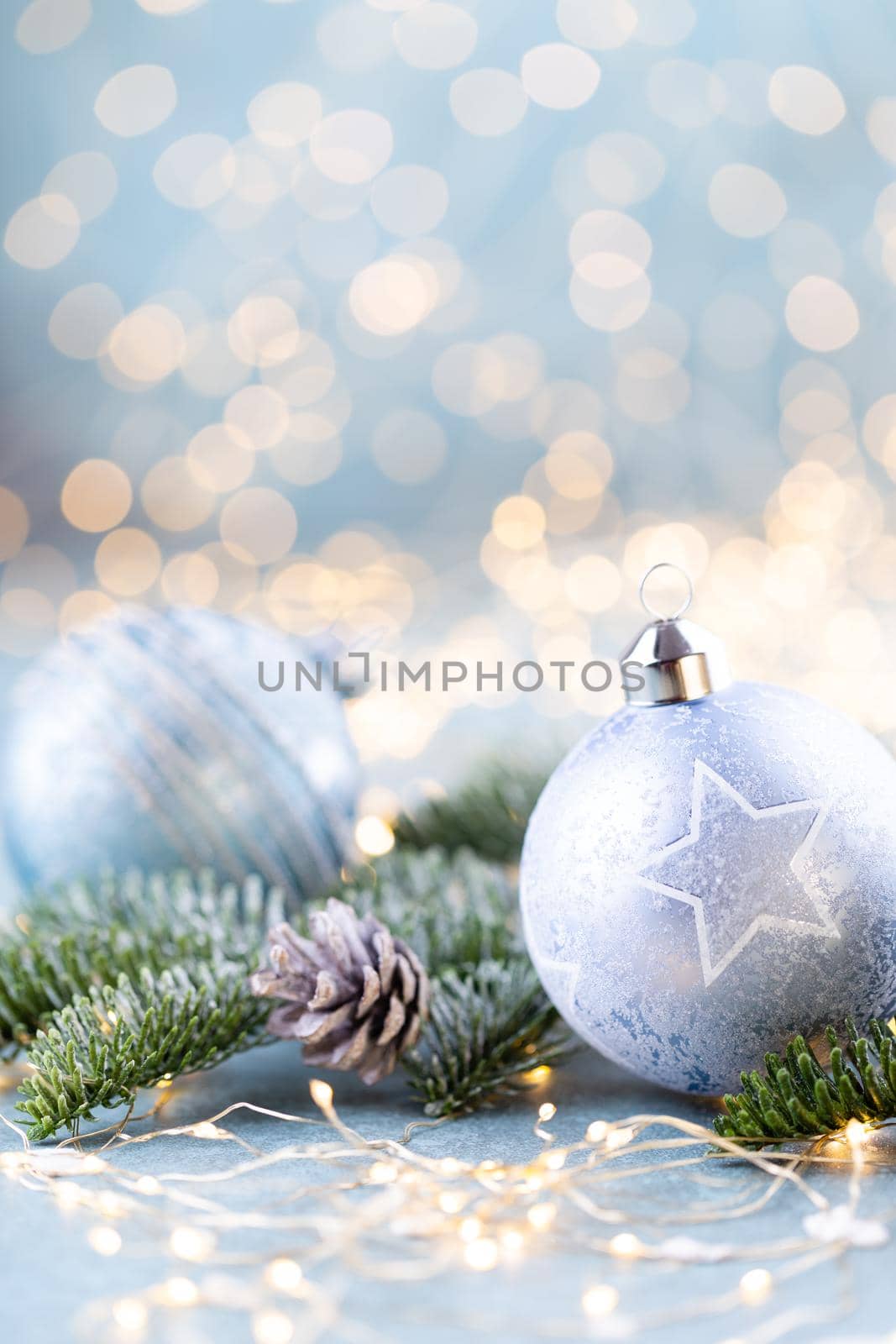 Christmas spruce with ball and blurred shiny lights. by gitusik