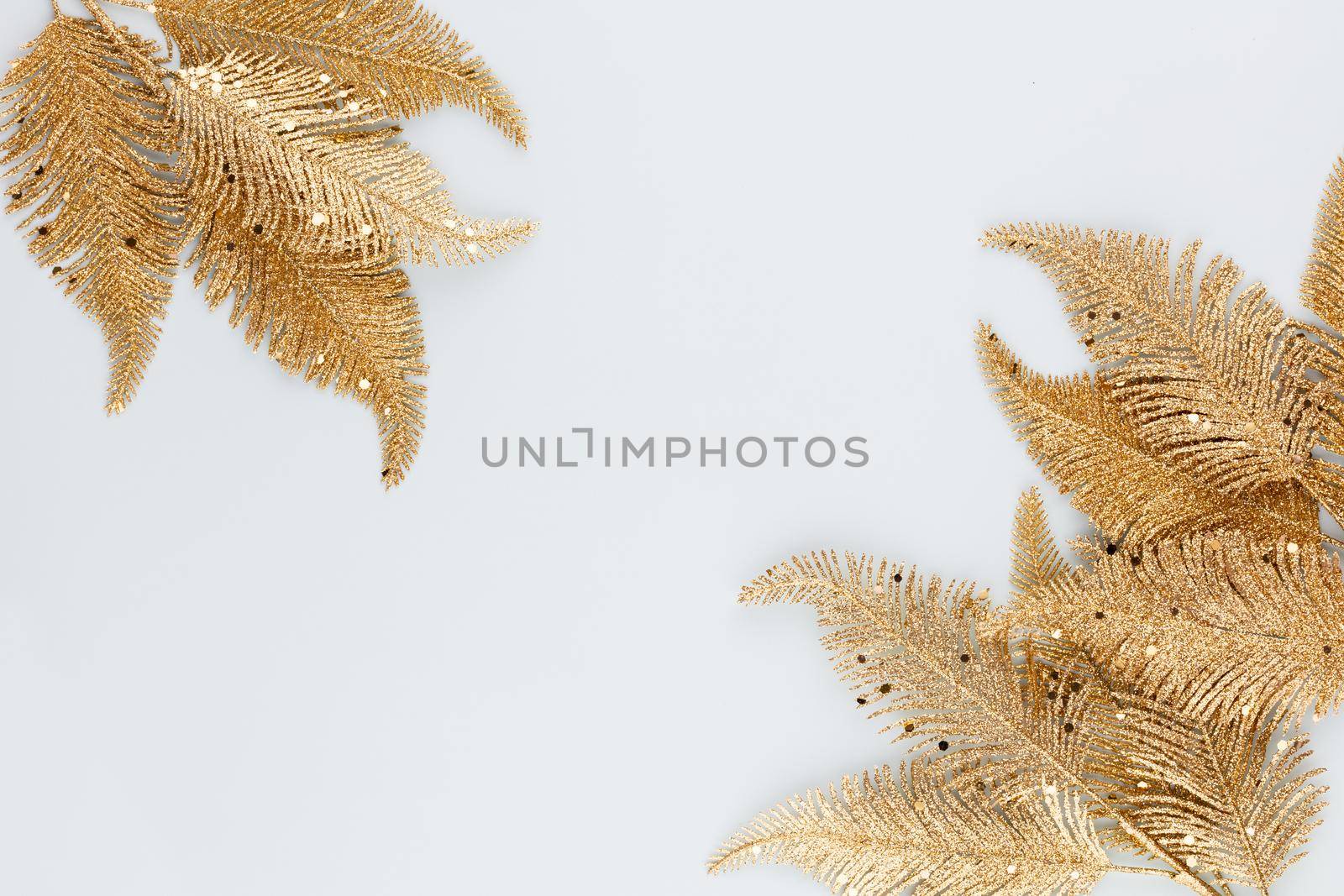  Palm gold leaf on blue background. Palm leaf, Flat lay and top view. by gitusik