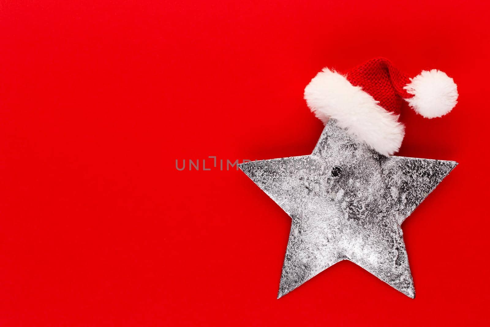 Christmas star, decor on pastel colored background. Christmas or New Year minimal concept. by gitusik