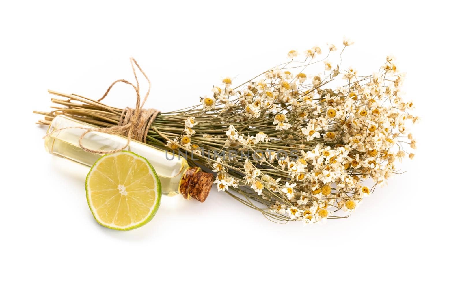 Composition with chamomile flowers and homemade cosmetic, essential oil, sopa,  on white background, top view. by gitusik