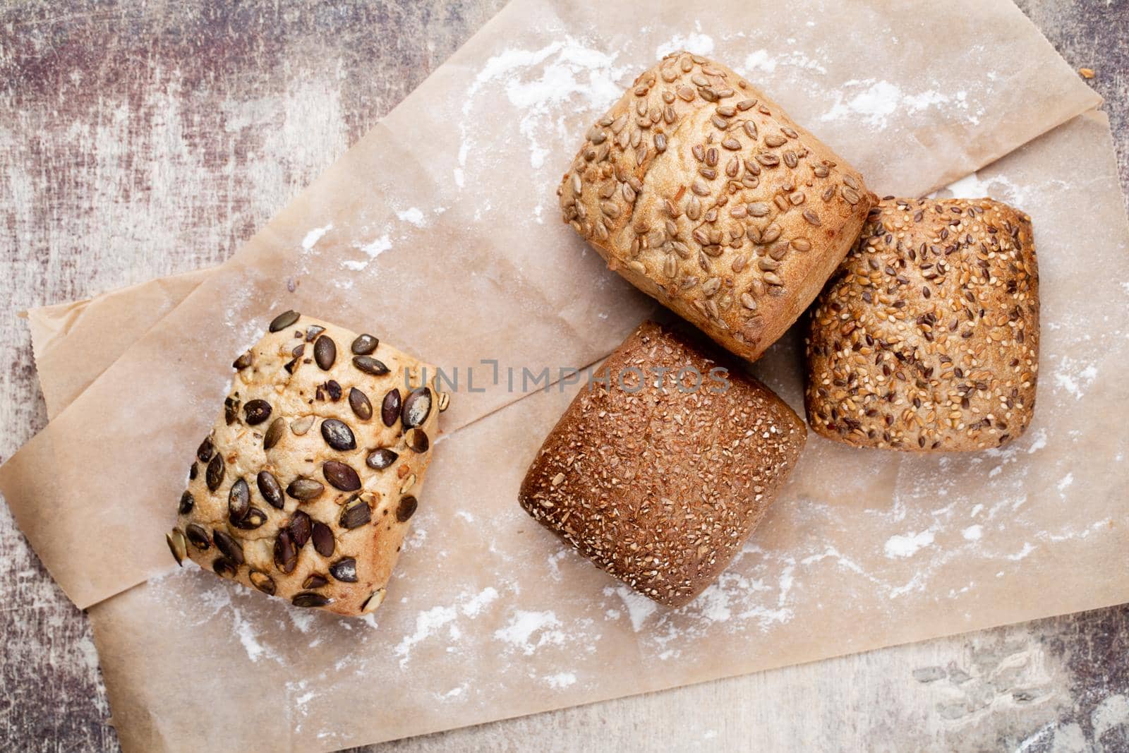 Freshly baked bread on dark gray kitchen table, top view.