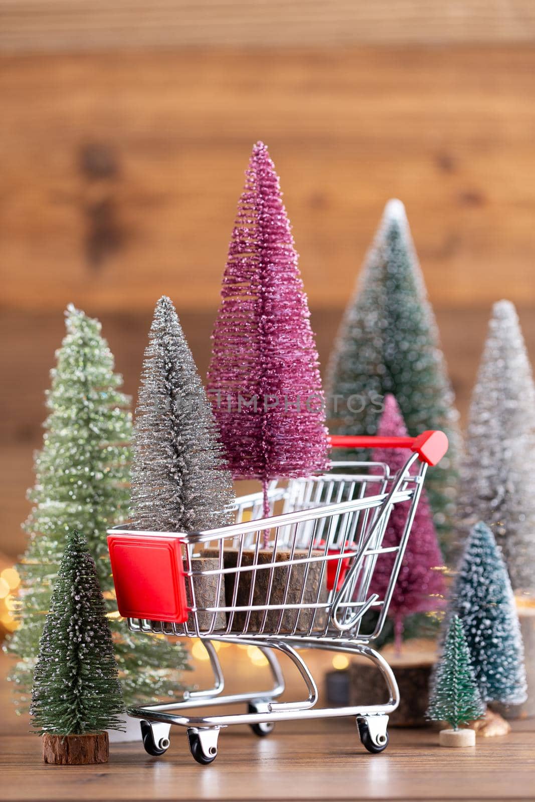 Colorful Christmas tree on wooden, bokeh background.  by gitusik