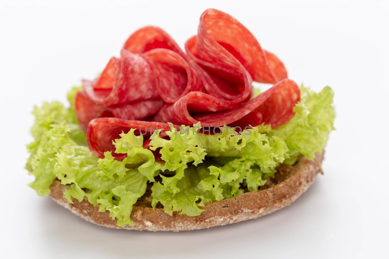 Sandwich with salami sausage on white background. by gitusik