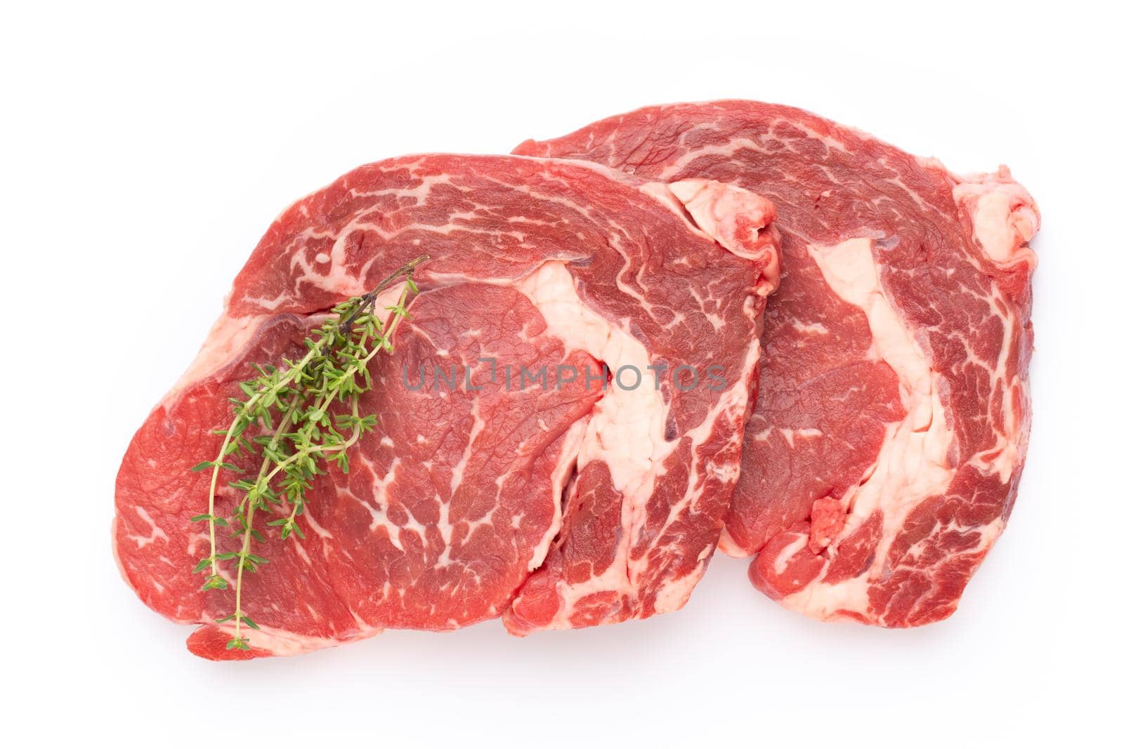 Fresh raw bio  beef steak isolated on white background. by gitusik