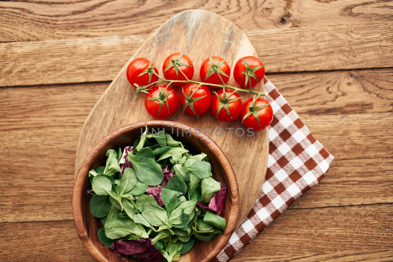 salad plate vegetables fresh ingredients wooden table kitchen by Vichizh