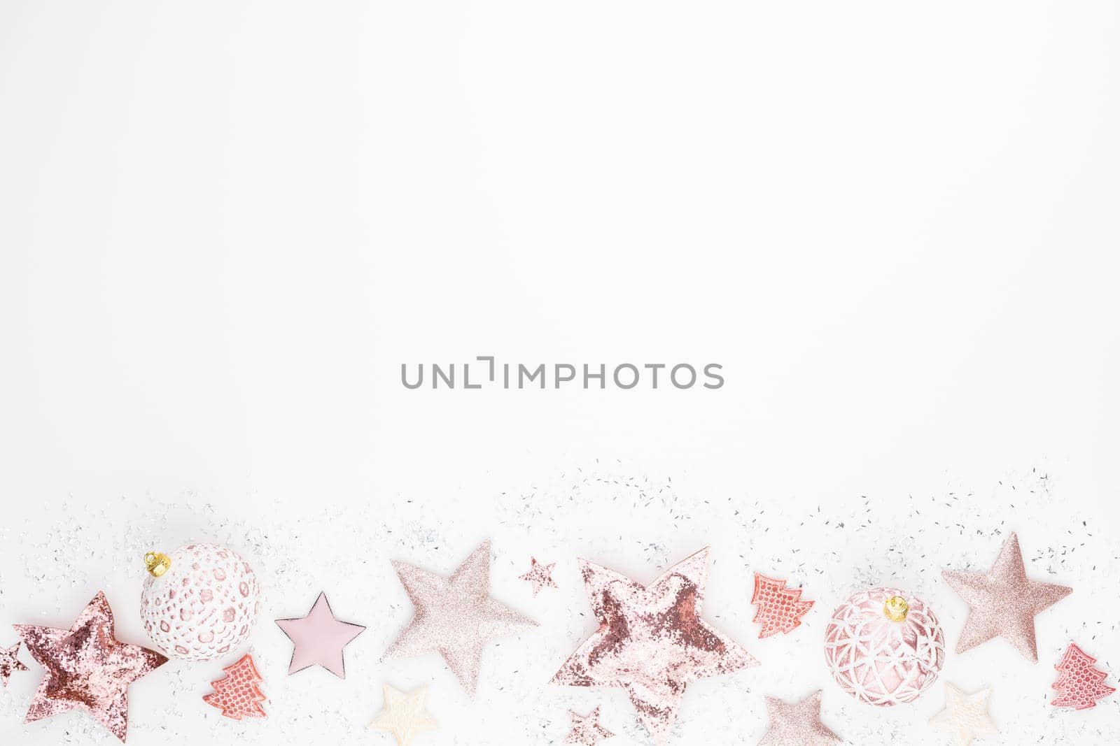 New Year celebration and Christmas background pink stars and Christmas decorations top view. by gitusik