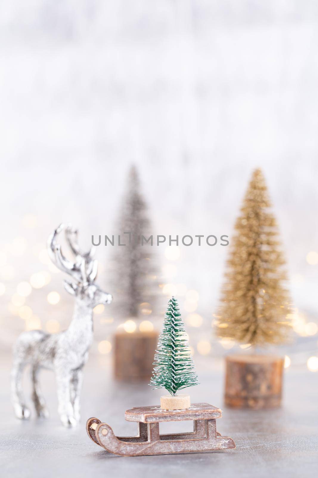 Christmas tree on silver, bokeh background.