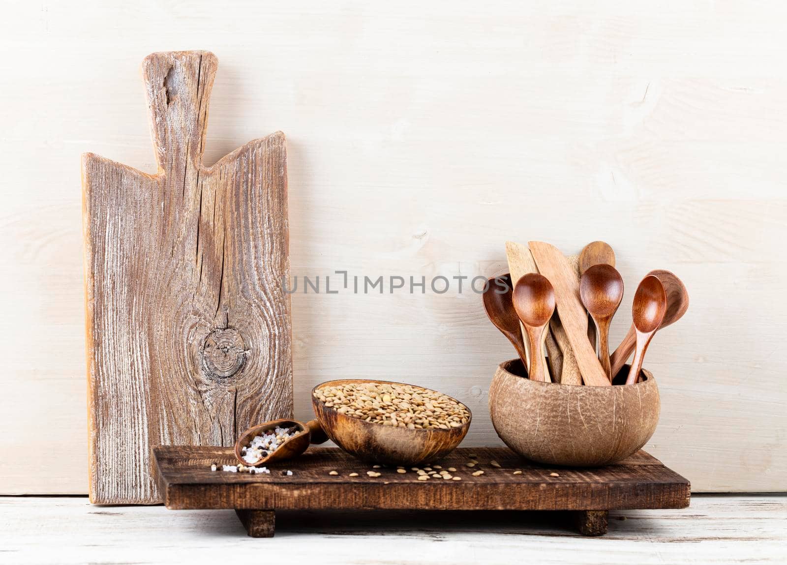 Interior design of gray kitchen wall with copper equipment and chopping board