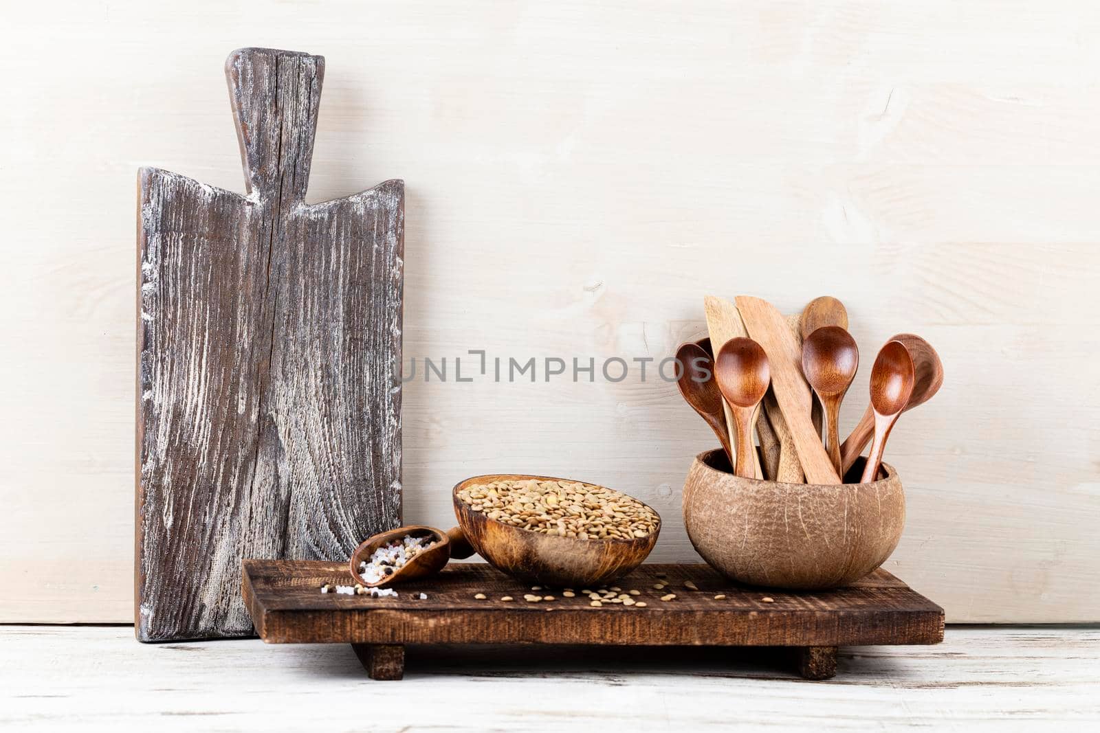 Interior design of gray kitchen wall with copper equipment and chopping board by gitusik