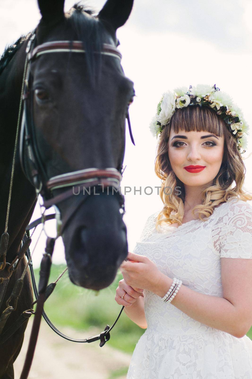 girl with red lips near a black horse by Andreua