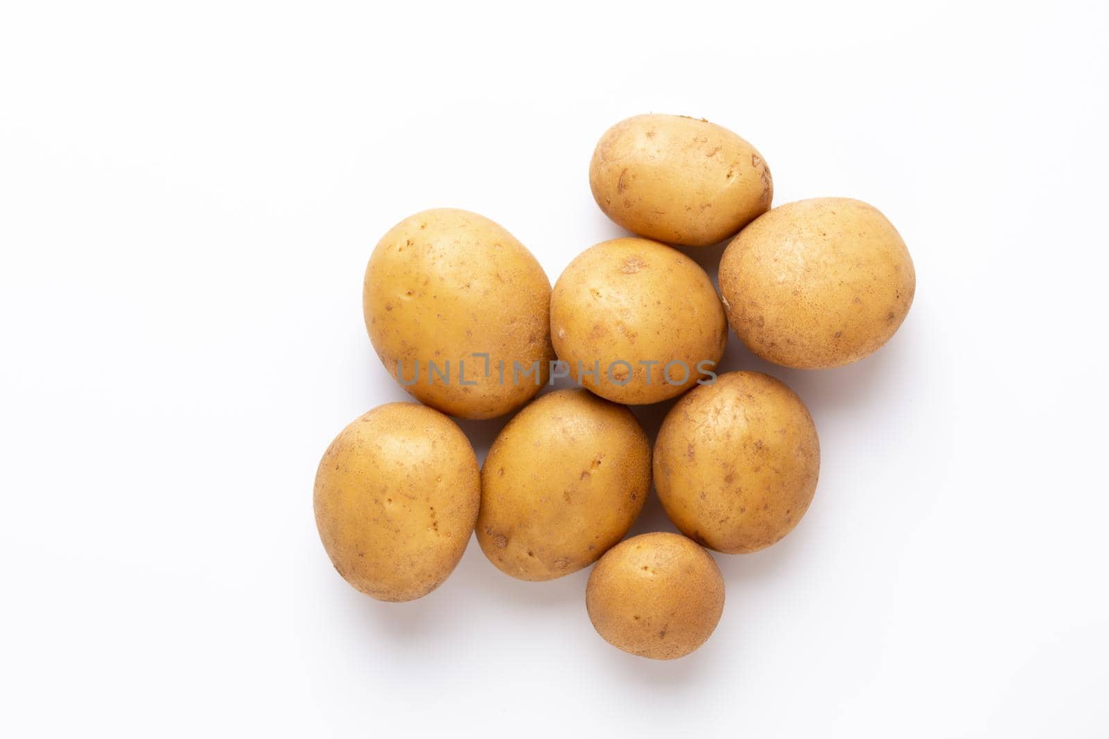 Potatoes isolated on white background. Flat lay. Top view. by gitusik
