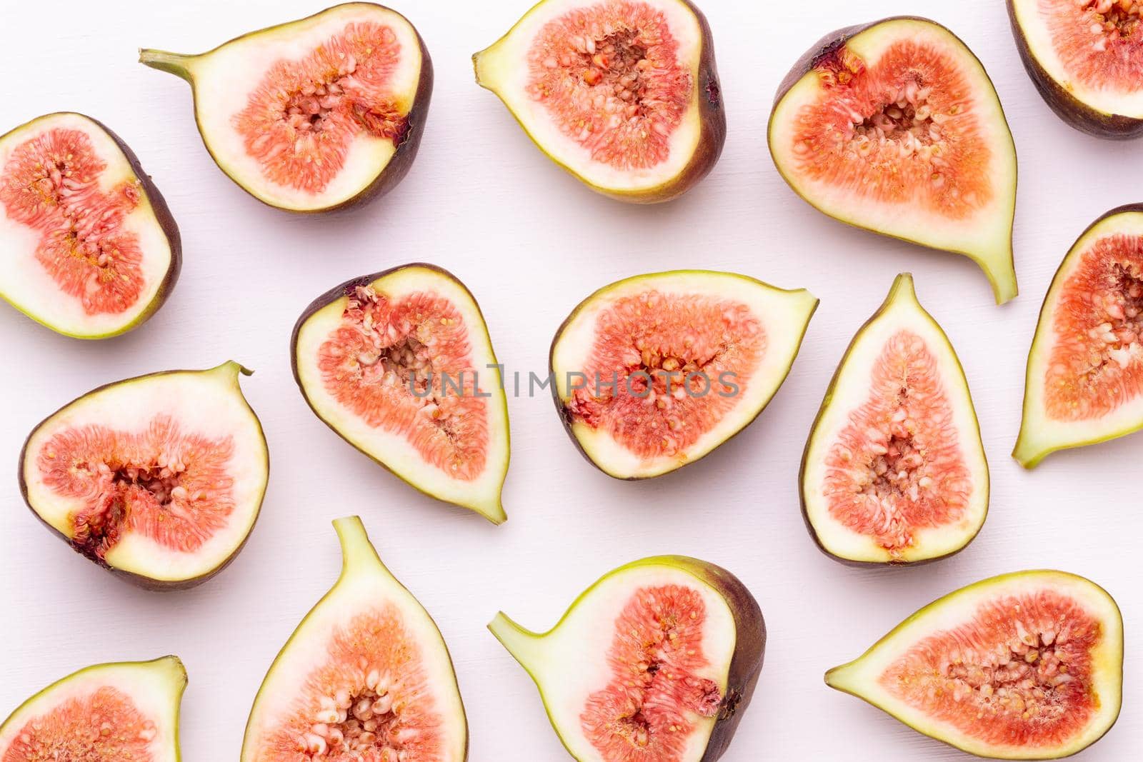 Fig fruits isolated on white background. Top view. Flat lay pattern by gitusik