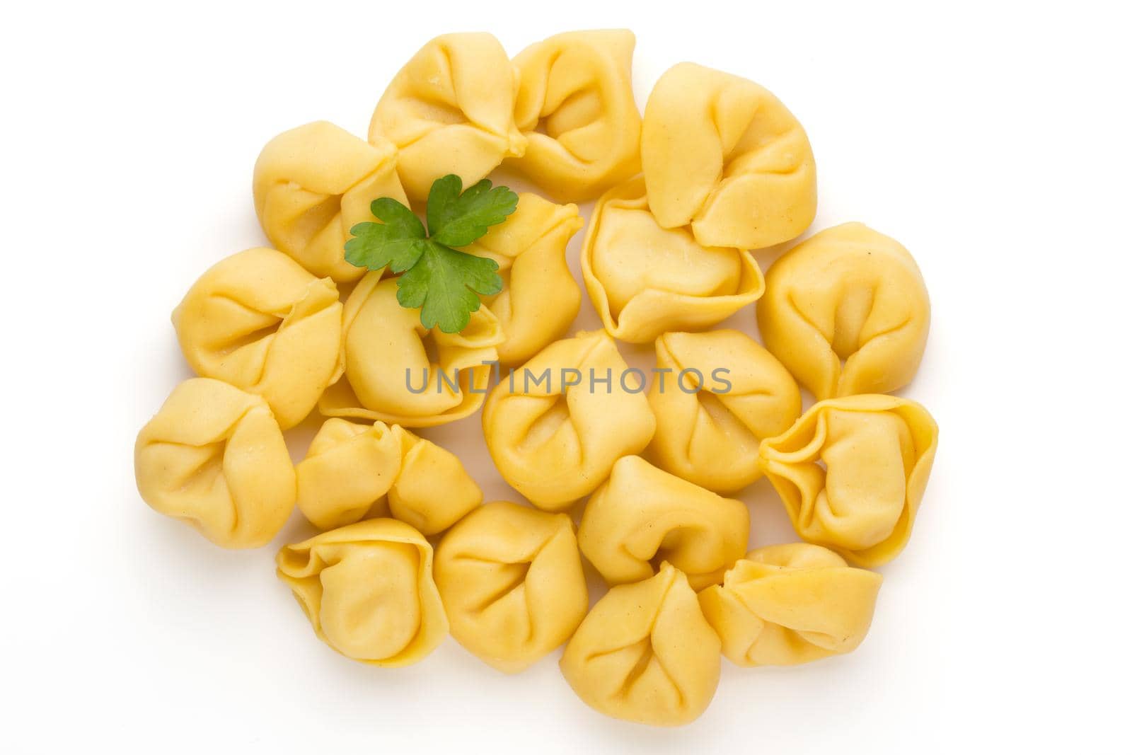 Raw homemade pasta,tortellini with herbs. by gitusik