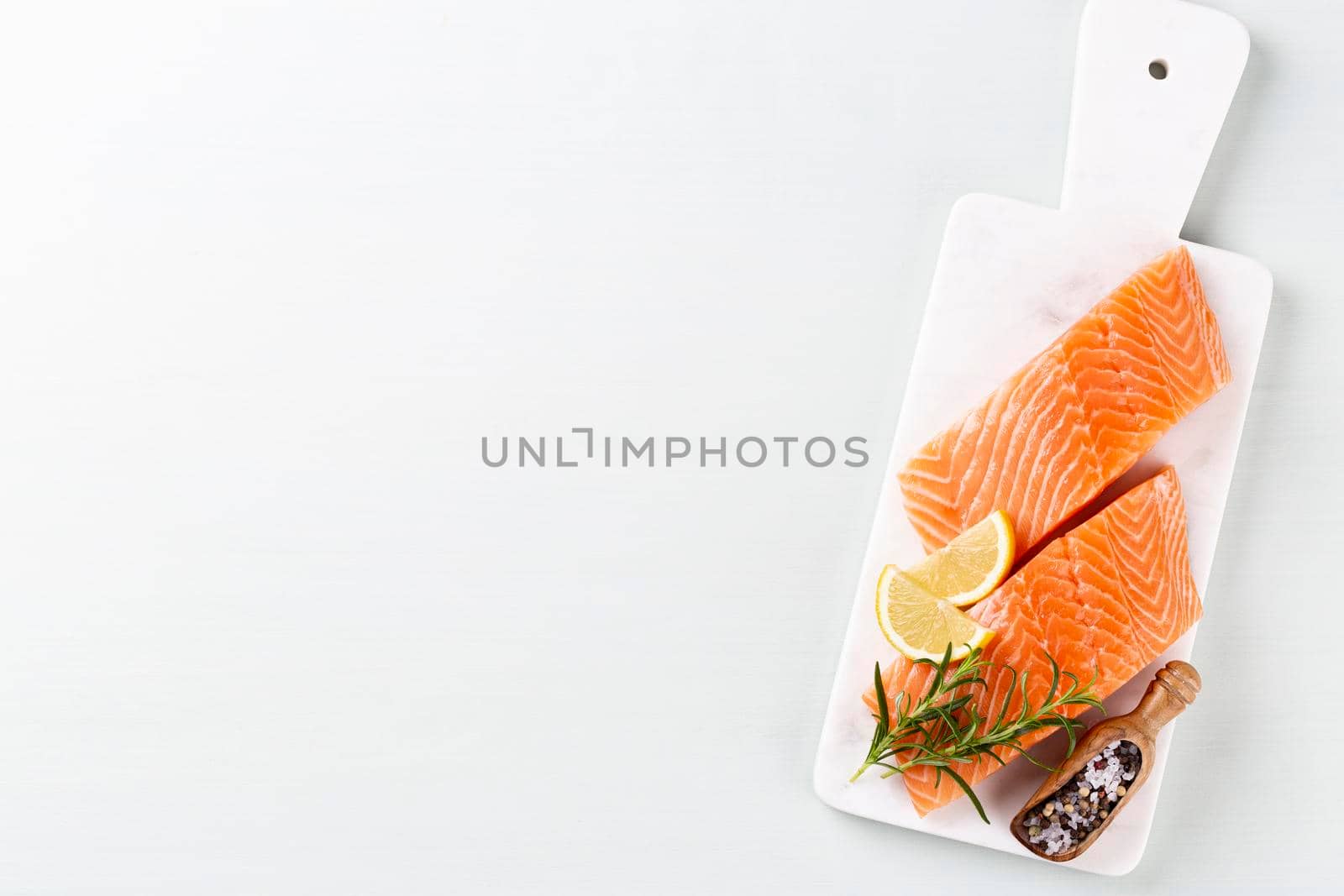 Fresh salmon steak with spinach and lentils.