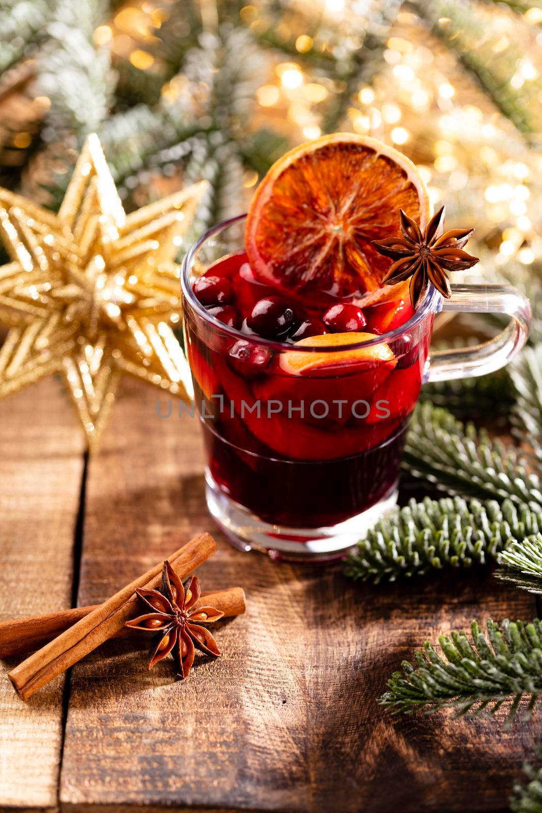 Christmas mulled wine with spices on a wooden rustic table. by gitusik