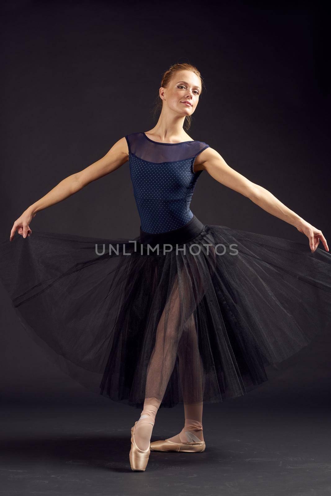 beautiful woman in a black dress dance fashion exercise isolated background by Vichizh