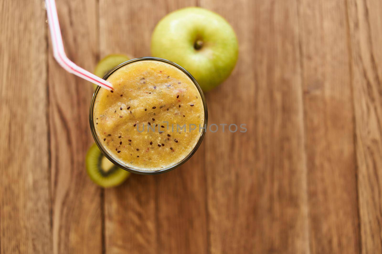 smoothie fresh fruit cocktail dessert healthy food in wooden background by Vichizh