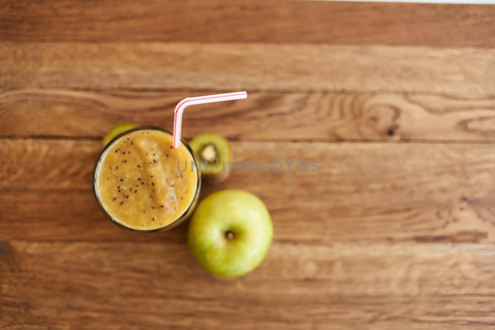 smoothie fresh fruit cocktail dessert healthy food in wooden background by Vichizh