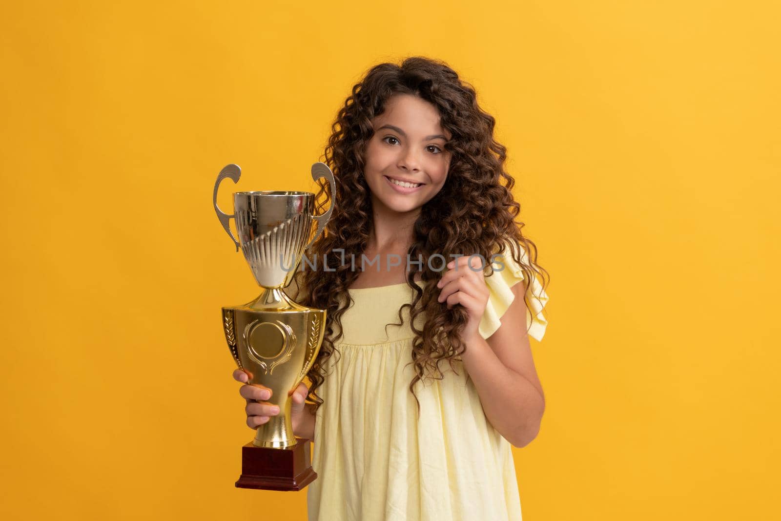 trophy and prestige. kid got prize. inspiration and motivation. child champion is winner. smiling teen girl hold golden cup. achievement award. celebrating success and victory.