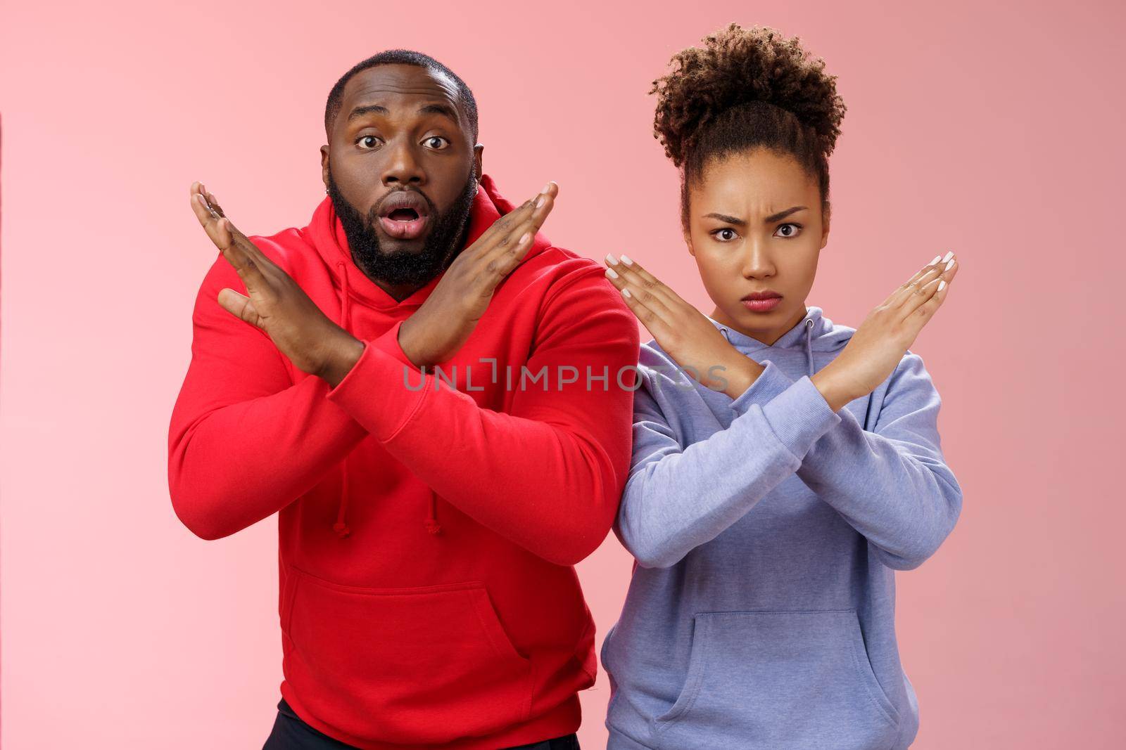 Serious-looking nervous panicking two african american guy girl showing cross stop gesture man feel worried shocked asking not do prohitibit action woman angry look camera demand quit.