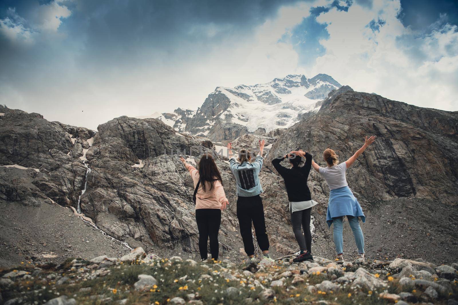 A group of girlfriends climbed high in the mountains