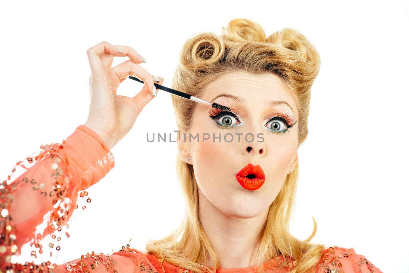 Attractive woman in red dress retro hairdo. Happy girl with mascara. Portrait smile blond woman in pinup style. Retro vintage concept